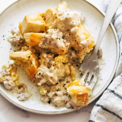 Biscuits and gravy egg bake on a plate.