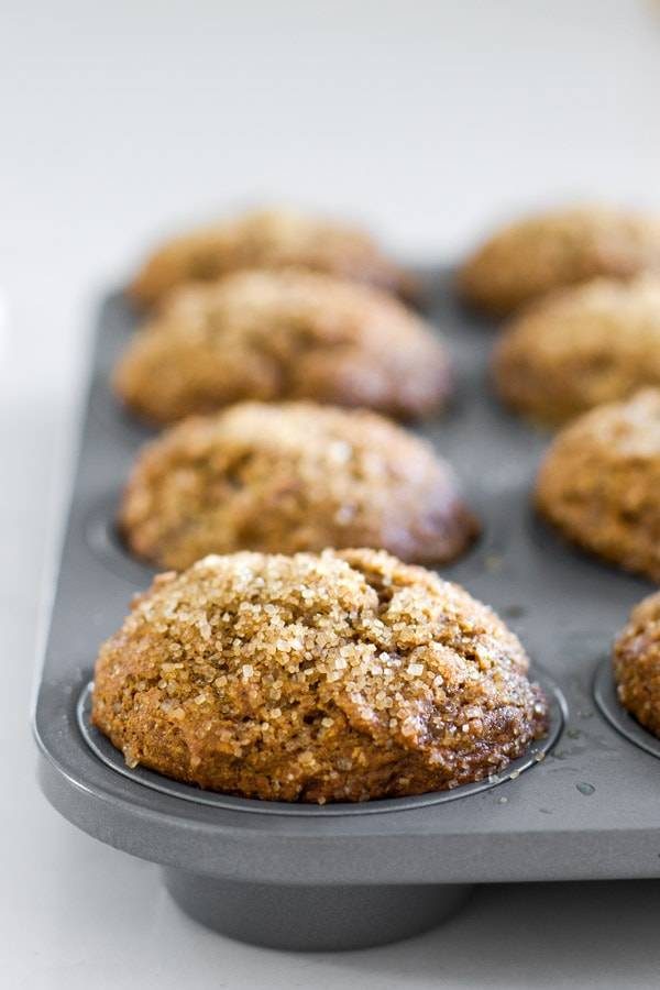 Gingerbread muffins in a muffin tin.